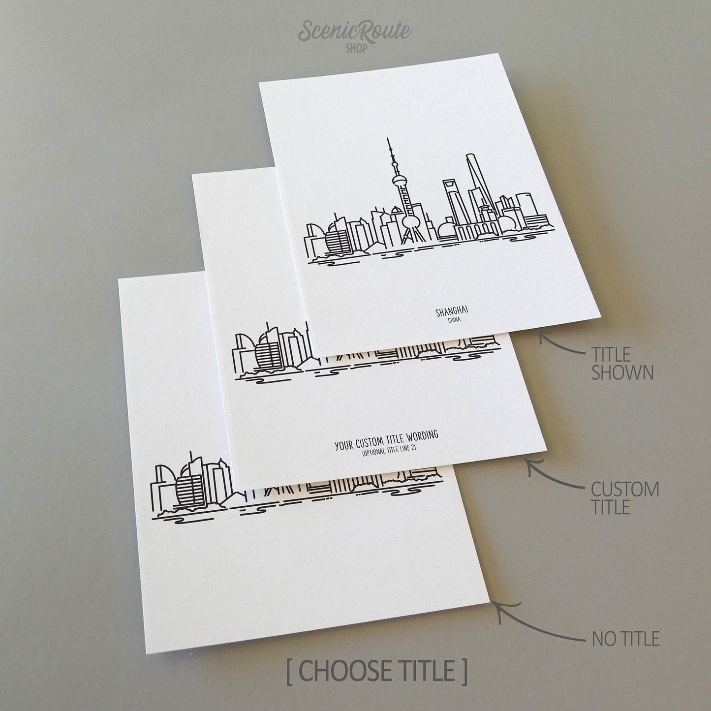 Three line art drawings of the Shanghai China Skyline on white linen paper with a gray background. The pieces are shown with title options that can be chosen and personalized.