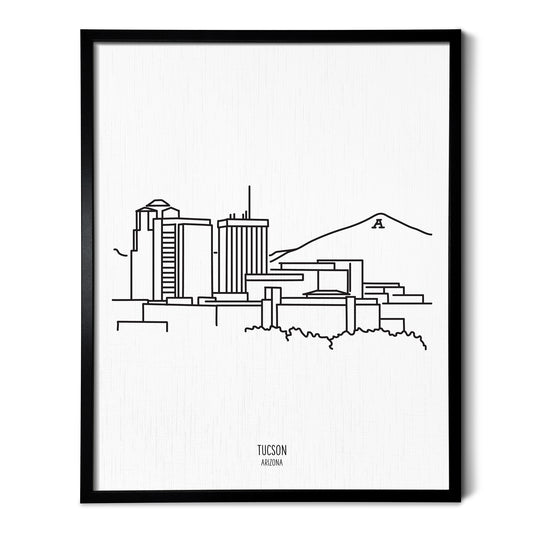 A line art drawing of the Tucson Arizona Skyline on white linen paper in a thin black picture frame