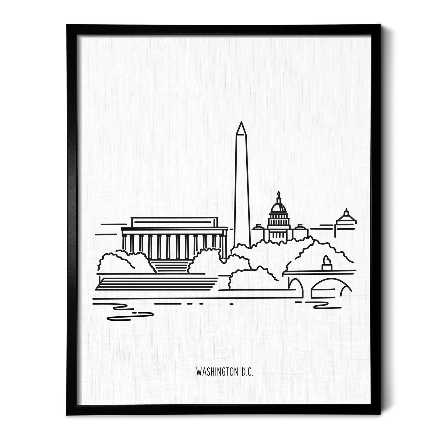 A line art drawing of the Washington DC Skyline on white linen paper in a thin black picture frame