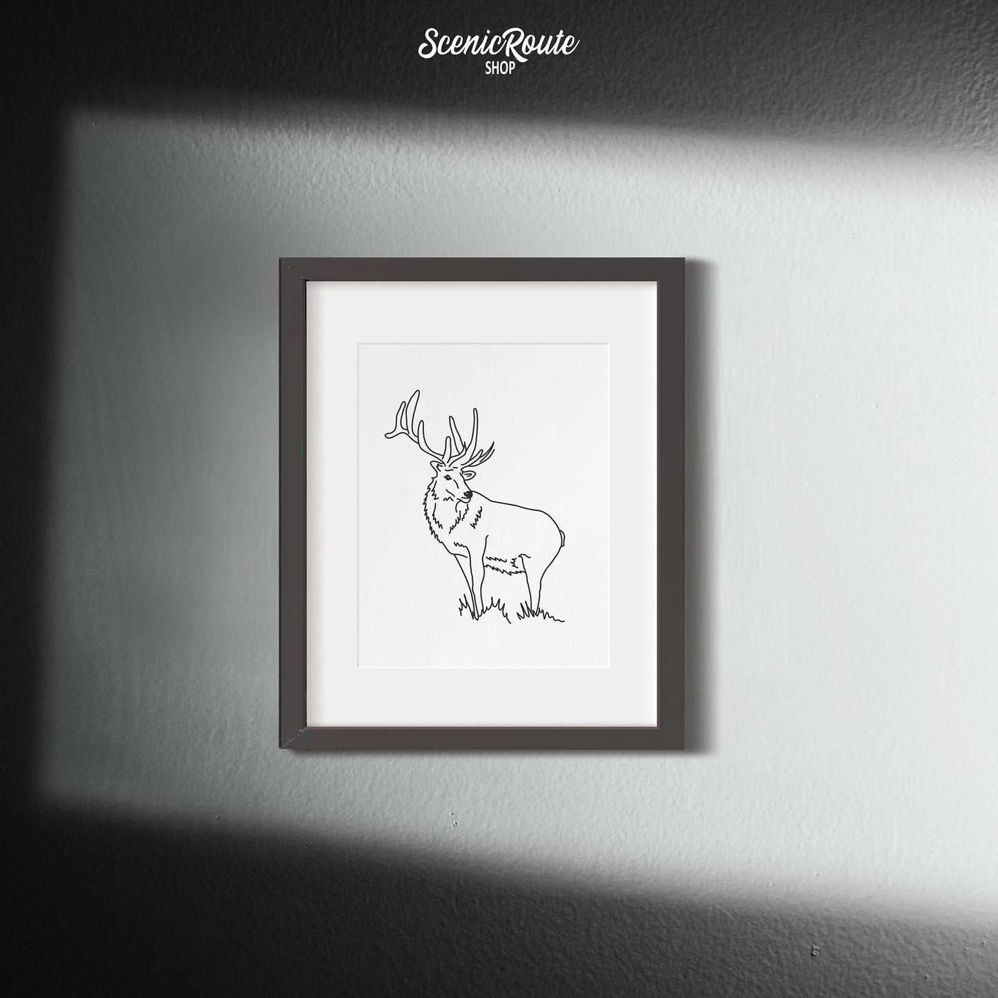 A framed line art drawing of an Elk