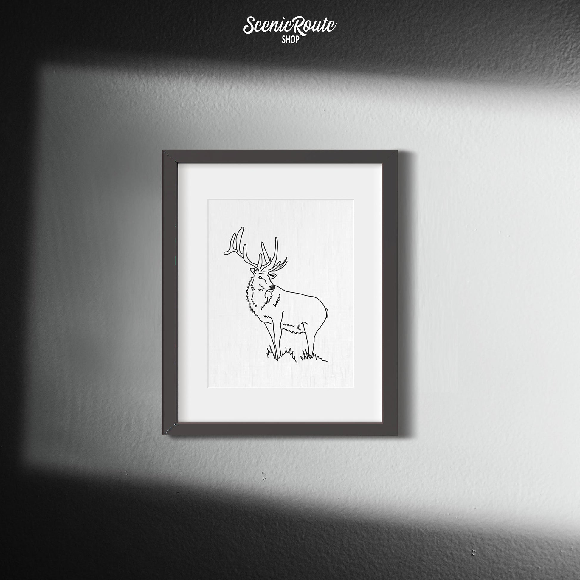 A framed line art drawing of an Elk